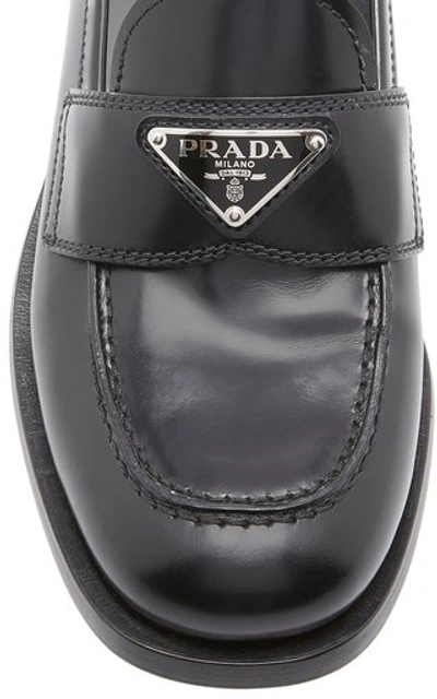 Shop Prada Leather Loafers In Black