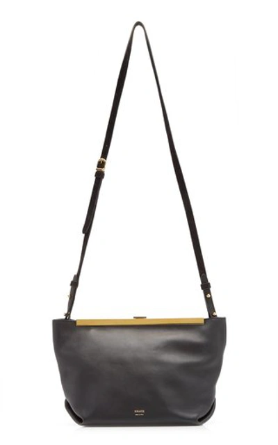 Shop Khaite Augusta Calf Leather Envelope Crossbody Bag In Black