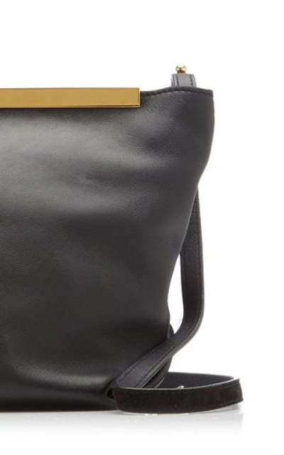 Shop Khaite Augusta Calf Leather Envelope Crossbody Bag In Black