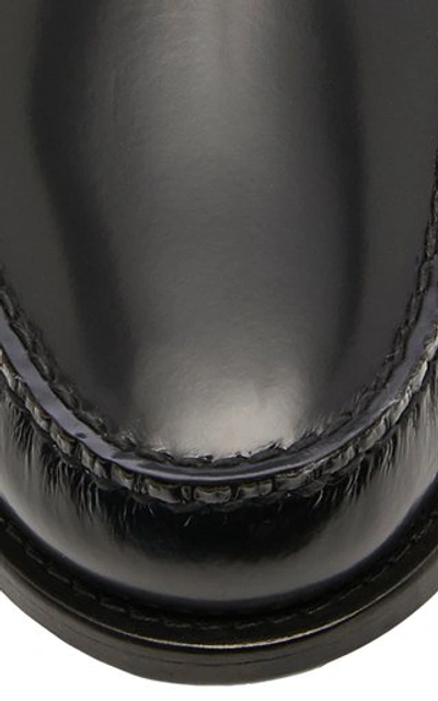 Shop Prada Logo-appliquéd Leather Penny Loafers In Black