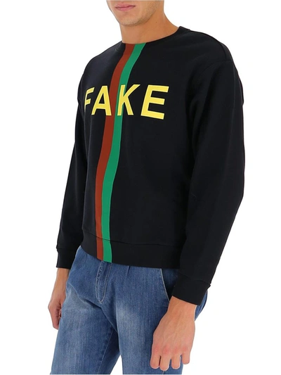 Shop Gucci Logo Printed Sweatshirt In Black