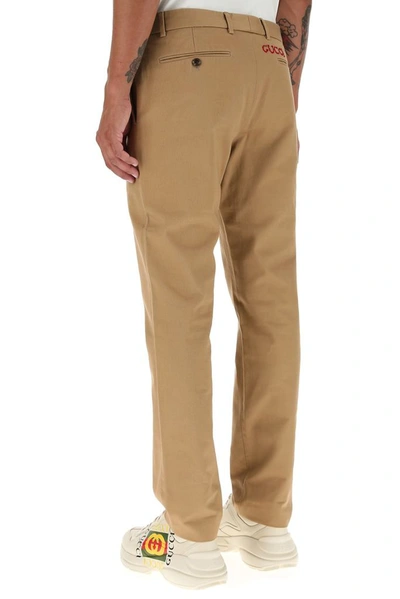 Shop Gucci Drill Chino Pants In Beige
