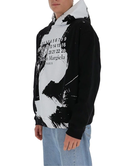 Shop Maison Margiela Paint Effect Hoodie In Black