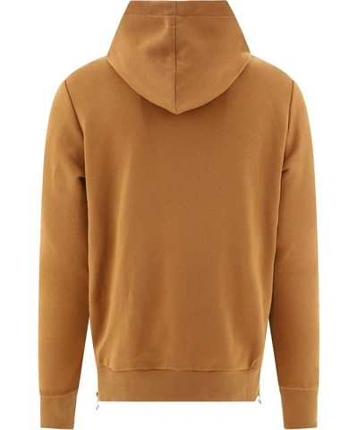 Shop Balmain Logo Embossed Hoodie In Brown