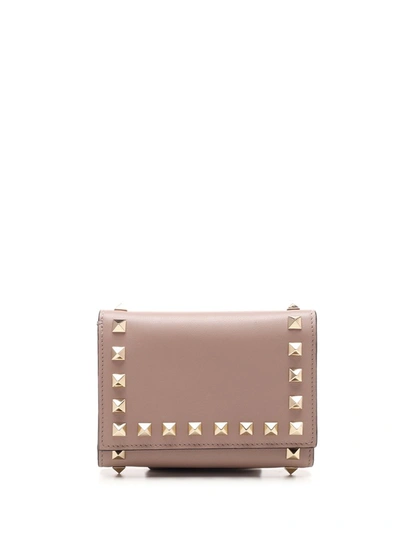 Shop Valentino Garavani Rockstud Trifold Wallet In Beige