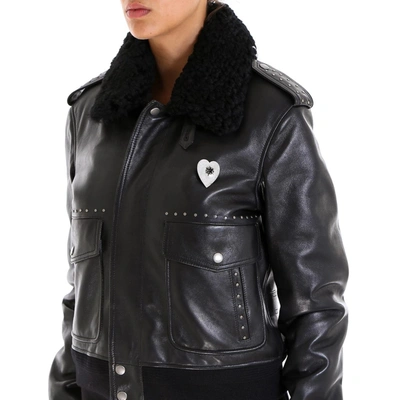 Shop Saint Laurent Studded Leather Jacket In Black