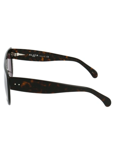 Shop Alaïa Square Frame Sunglasses In Brown