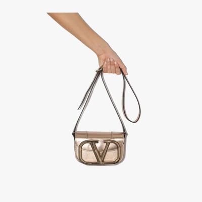 Shop Valentino Gold Tone Supervee Small Leather Cross Body Bag