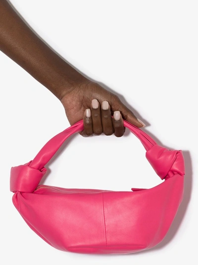 Shop Bottega Veneta Pink Double Knot Leather Clutch Bag