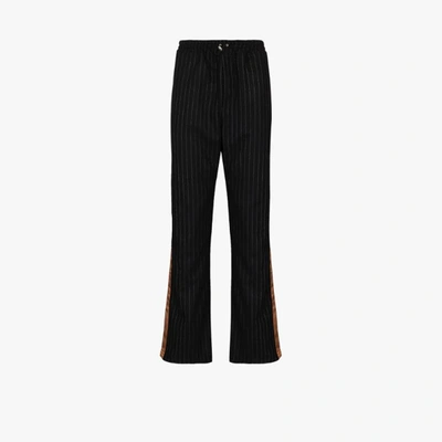 Shop Ahluwalia Kyle Pinstripe Wool Trousers In Black