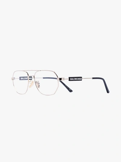 Shop Balenciaga Gold Tone Tag Aviator Glasses