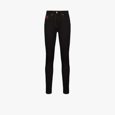 Shop Versace Rose Embroidered Skinny Jeans In Black