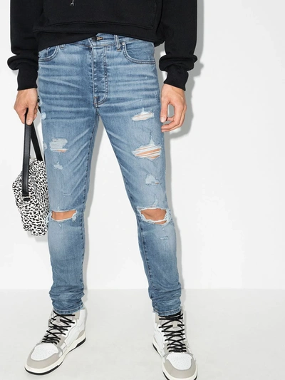 Shop Amiri Thrasher Distressed Skinny Jeans In Blue