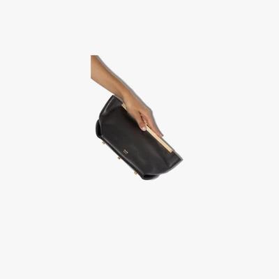 Shop Khaite The Aimee Leather Clutch Bag In Black