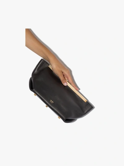 Shop Khaite The Aimee Leather Clutch Bag In Black