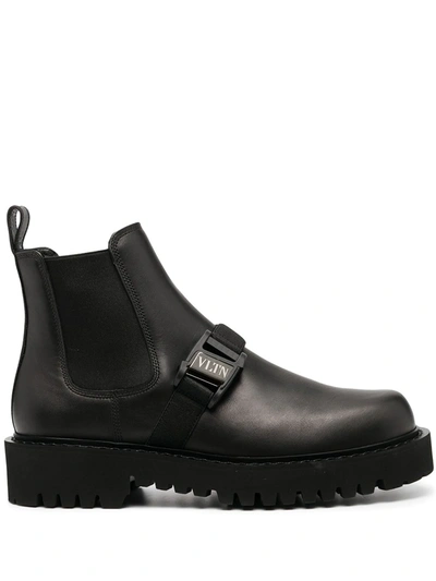 Shop Valentino Vltn Buckle Beatle Boots In Black