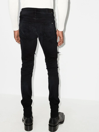 Shop Amiri Scarf Patch Skinny Jeans In Black