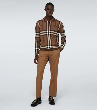 Shop Burberry Checked Long-sleeved Polo Shirt In Brown