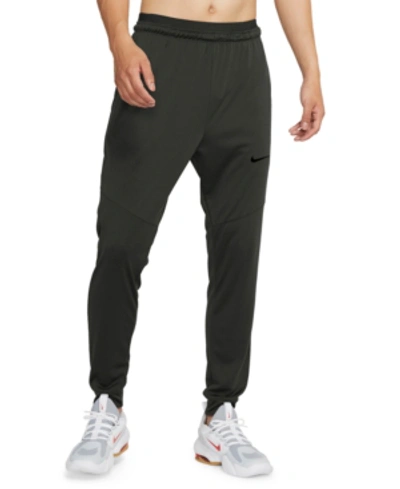 Shop Nike Men's Dry-fit Tapered Pants In Sequoia Green/black