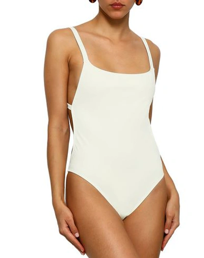 Shop Solid & Striped One-piece Swimsuits In Ivory