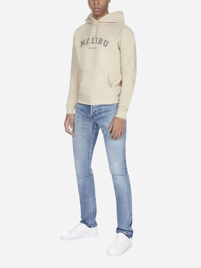 Shop Saint Laurent Distressed Slim-fit Denim Jeans