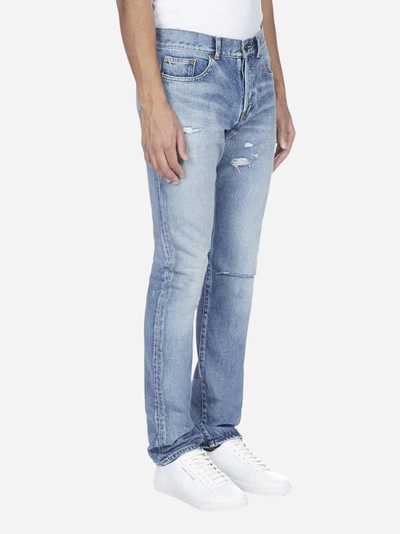 Shop Saint Laurent Distressed Slim-fit Denim Jeans