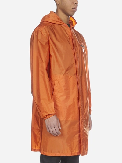 Shop Prada Logo-plaque Nylon Piuma Hooded Raincoat In Orange
