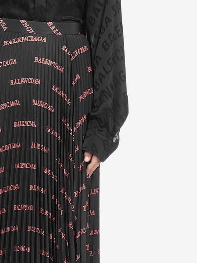 Shop Balenciaga Logo Print Pleated Asymmetric Skirt In Black - Red