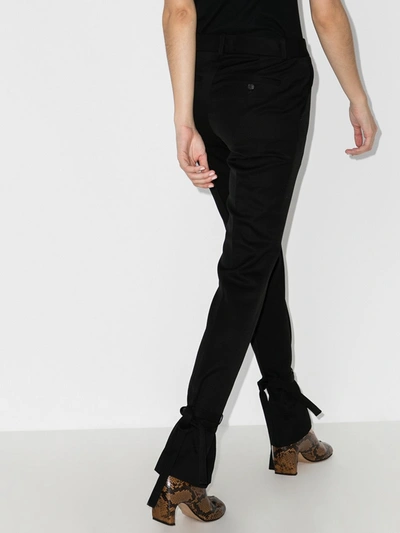 Shop Jw Anderson Ankle Tie Slim Wool Trousers In Black