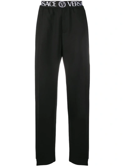 Shop Versace Wide-leg Logo Waistband Trousers In Black