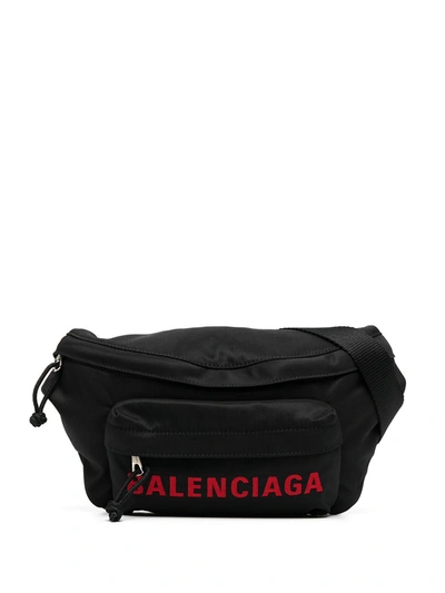 Shop Balenciaga Logo-print Belt Bag In Black