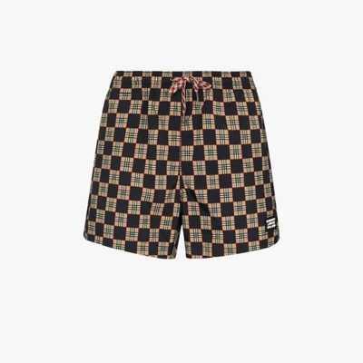 Shop Burberry Greenford Checked Swim Shorts In Black