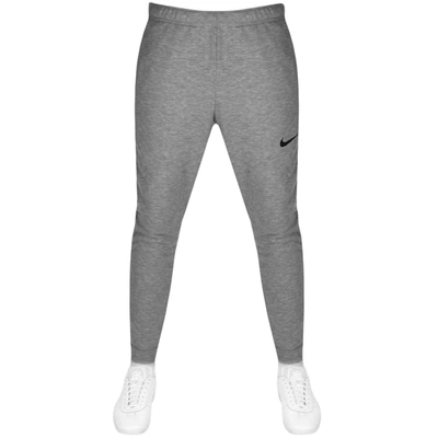 Shop Nike Training Tapered Jogging Bottoms Grey
