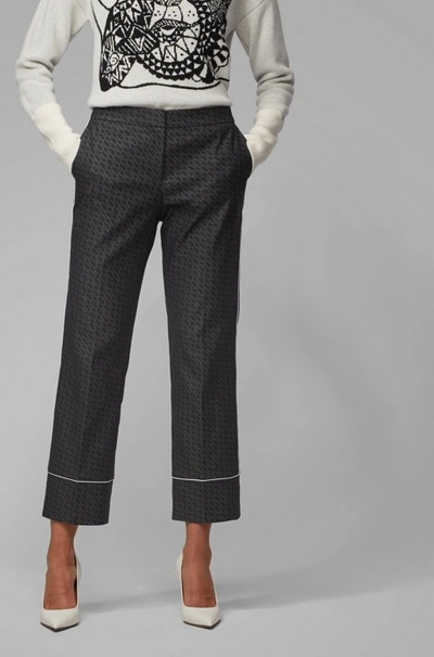 Shop Hugo Boss - Relaxed Fit Pants With All Over Monogram Pattern - Patterned