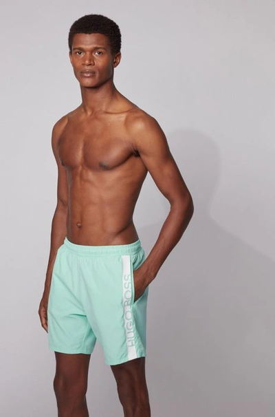 Shop Hugo Boss - Medium Length Swim Shorts With Heat Sealed Logo Print - Light Green