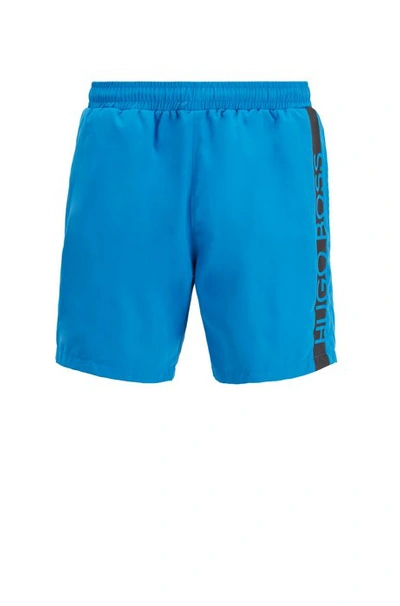 Shop Hugo Boss - Medium Length Swim Shorts With Heat Sealed Logo Print - Blue