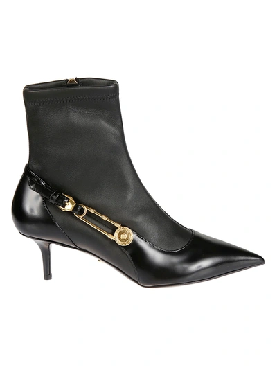 Shop Versace Safety Pin Buckled Ankle Boots In Black/gold