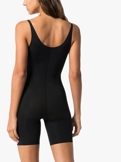 Shop Spanx Thinstincts Open-bust Mid-thigh Bodysuit In Black