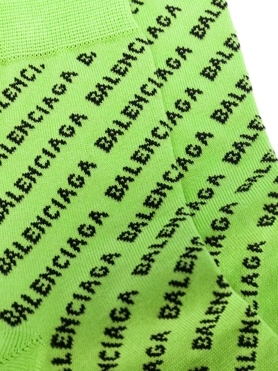 Shop Balenciaga All-over Logo Knitted Socks In Green