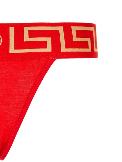 Shop Versace Greca Medusa Waistband Thong In Red