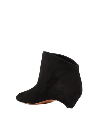 Shop Alaïa Ankle Boots In Black