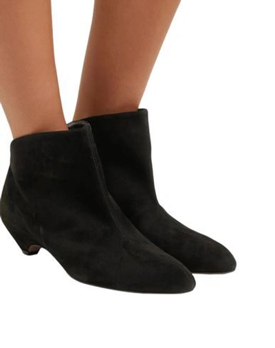 Shop Alaïa Ankle Boots In Black