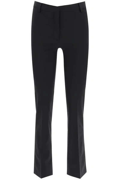 Shop Valentino Stretch Wool Trousers In Black