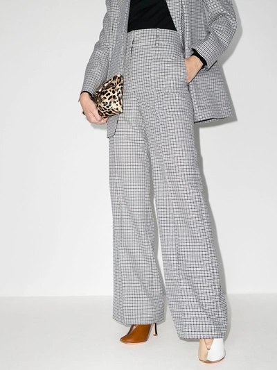 Shop Givenchy Houndstooth Wool Trousers In Black