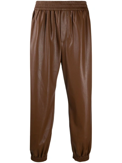Shop Nanushka Planet Man Elasticated Waist Trousers In Brown