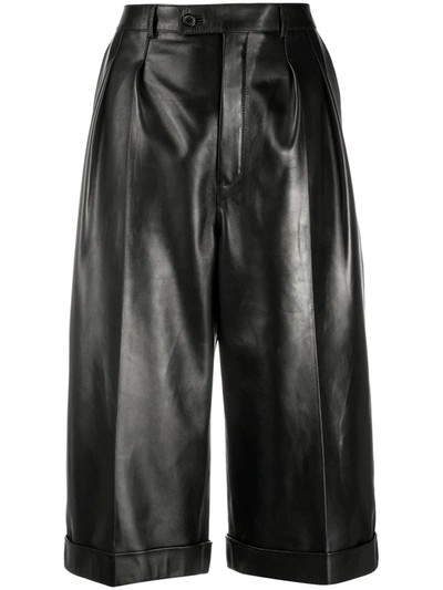 Shop Saint Laurent Over-the-knee Leather Shorts In Black