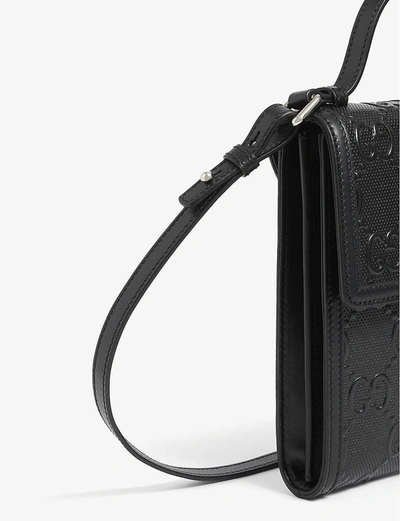 Shop Gucci Gg Branded Leather Messenger Bag In Black