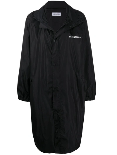 Shop Balenciaga Slogan-print High-neck Raincoat In Black