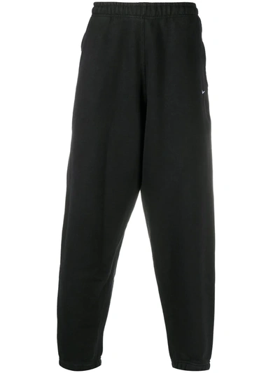 Shop Nike Logo-embroidered Joggers In Black
