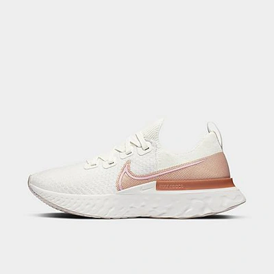 Shop Nike Women's React Infinity Run Flyknit Running Shoes In Sail/light Arctic Pink/metallic Copper/white/lt Orewood Brown